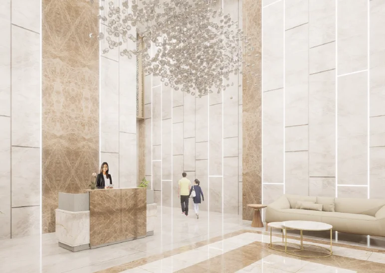 Forbes Fab Luxe grand lobby lounge with marble and gold walls, elegant reception desk and chandelier lighting