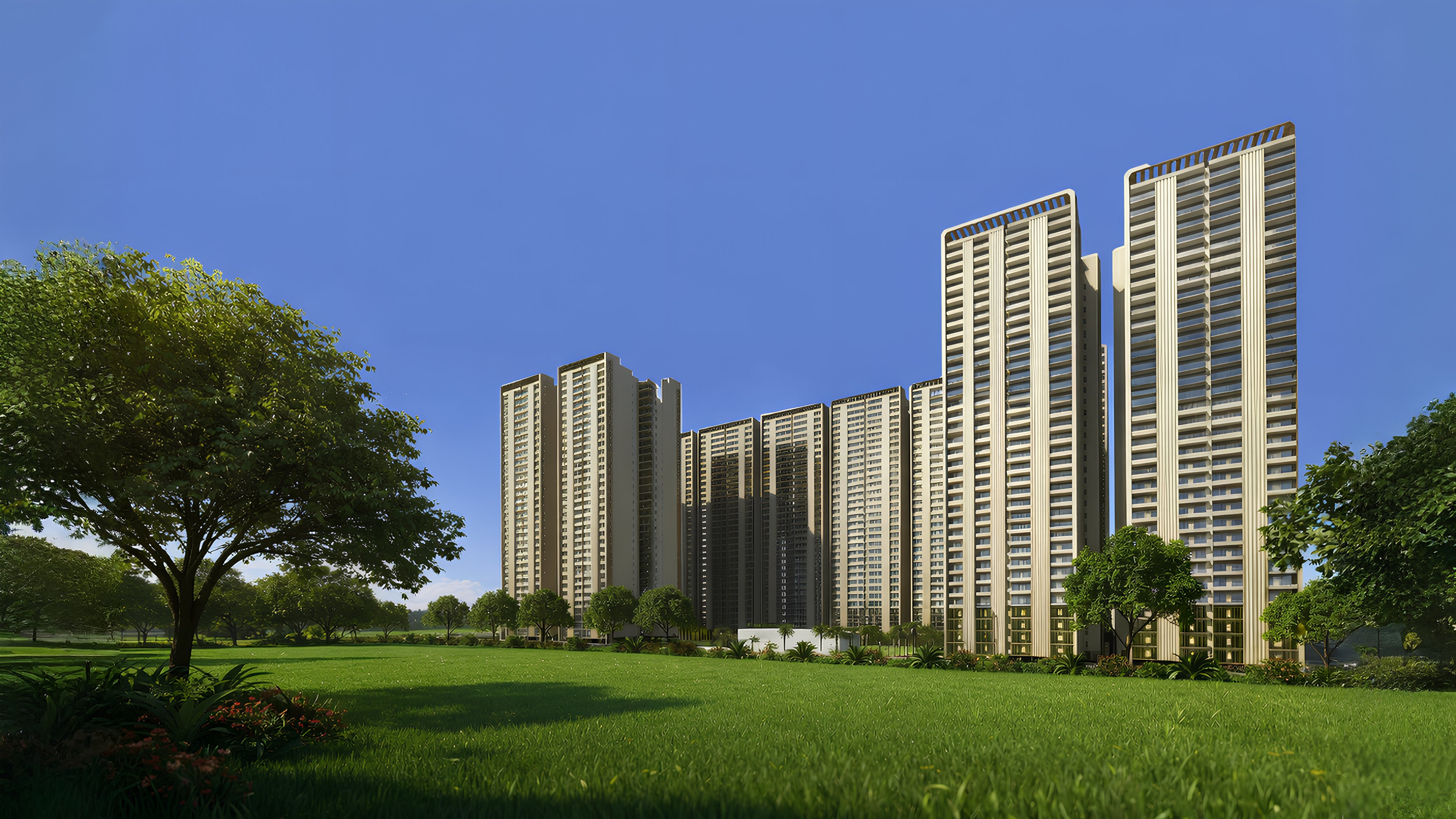 Forbes Fab Luxe towers rising from a green field under clear blue sky in Sector 4, Greater Noida West